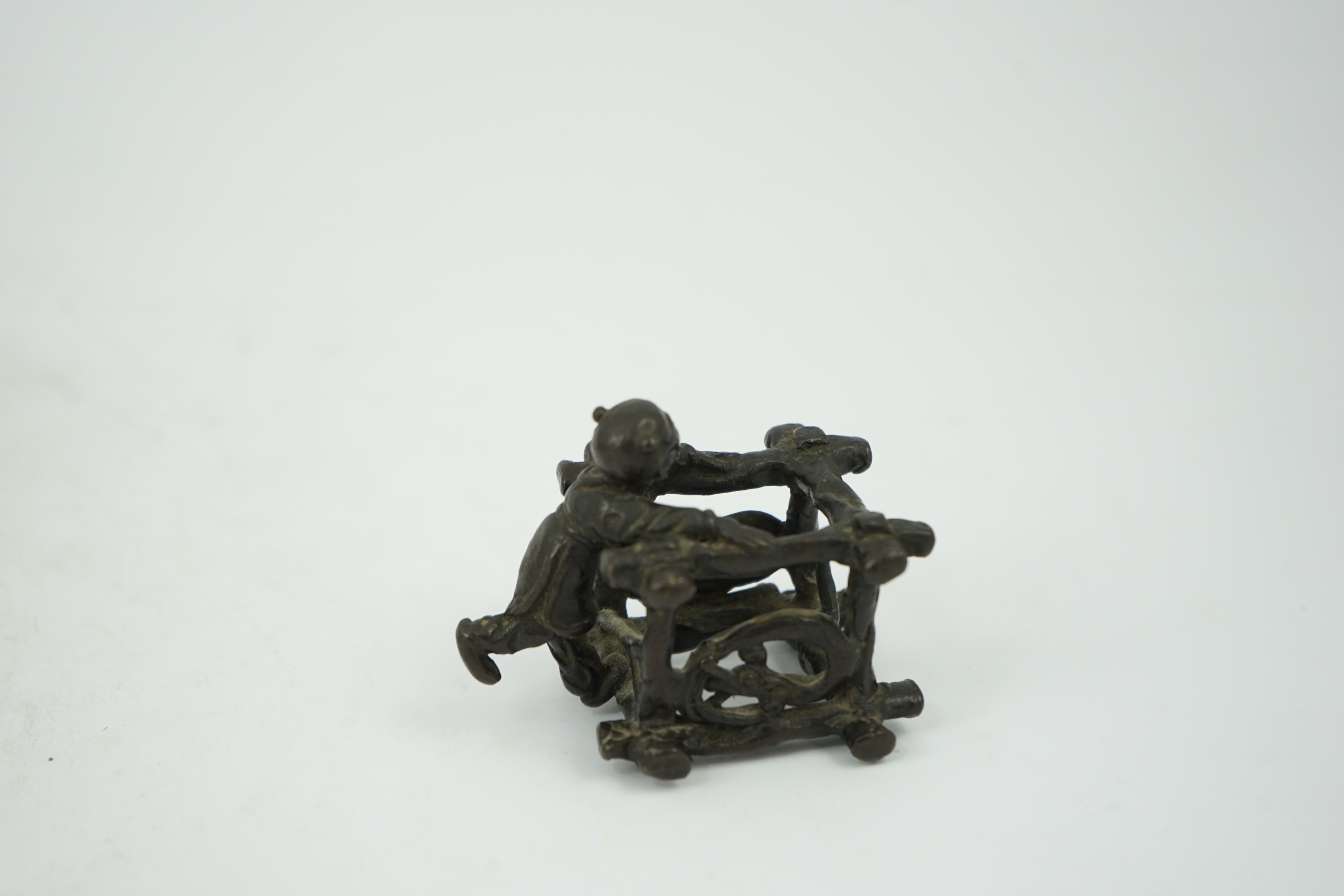 A Chinese bronze figural scroll weight, late Ming